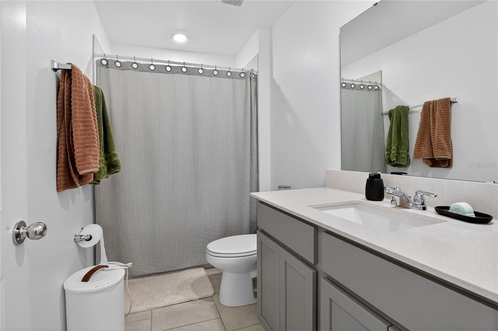545 Bell Prairie Circle Lake Wales, FL 33859 - Photo 26 of 42 a bathroom with a sink toilet and shower
