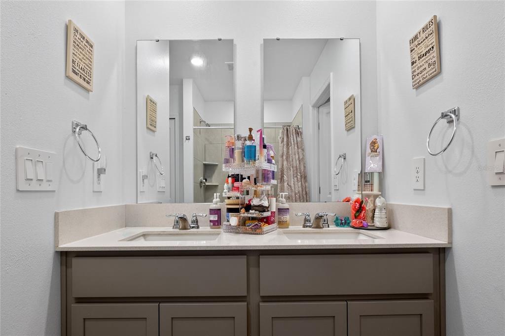 545 Bell Prairie Circle Lake Wales, FL 33859 - Photo 27 of 42 a bathroom with double sink and a mirror