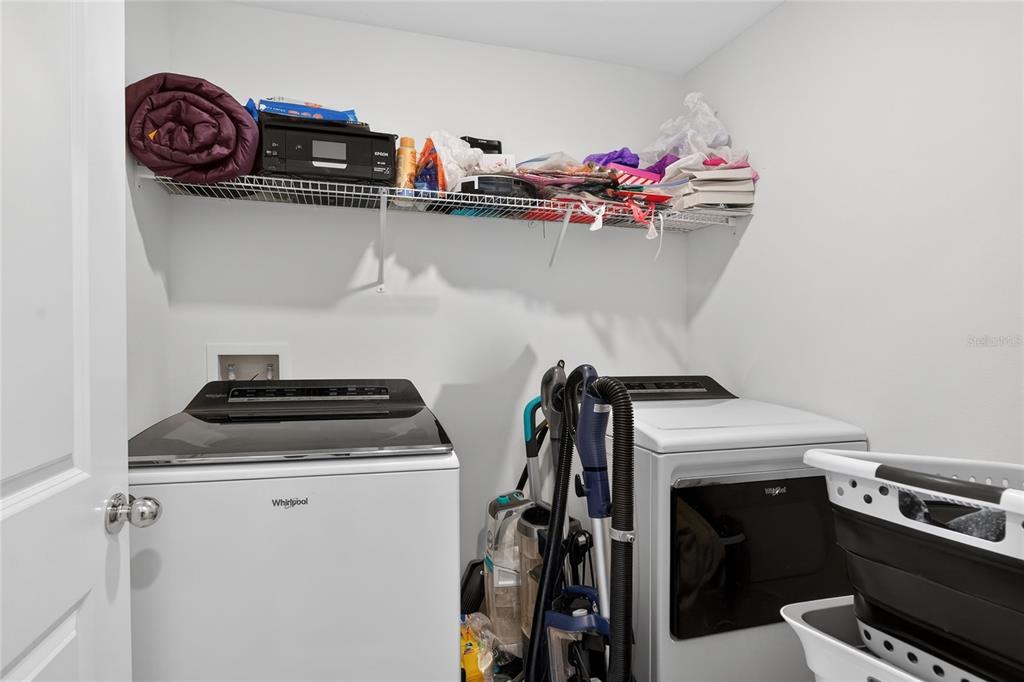 545 Bell Prairie Circle Lake Wales, FL 33859 - Photo 28 of 42 a utility room with dryer and washer