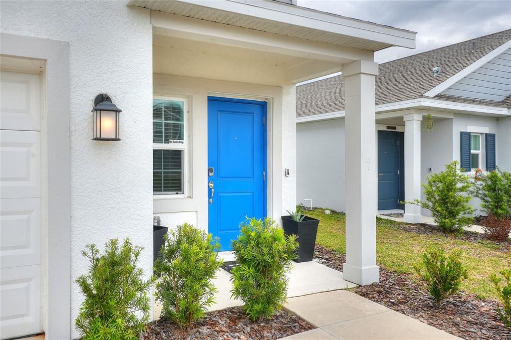 545 Bell Prairie Circle Lake Wales, FL 33859 - Photo 29 of 42 a front view of a house with garden