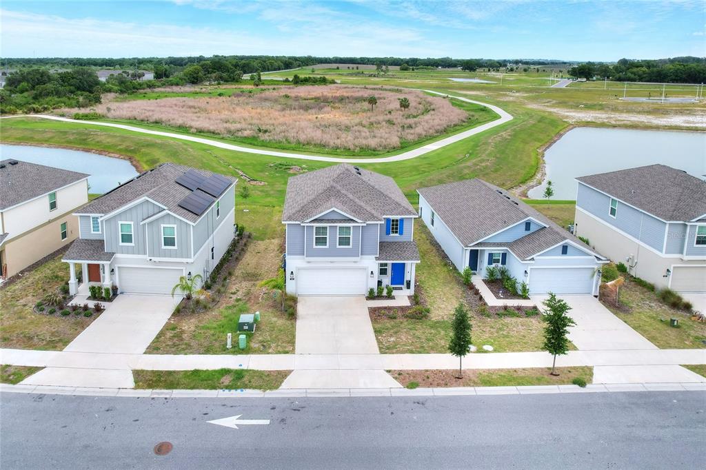 545 Bell Prairie Circle Lake Wales, FL 33859 - Photo 31 of 42 an aerial view of a house with a garden and lake view