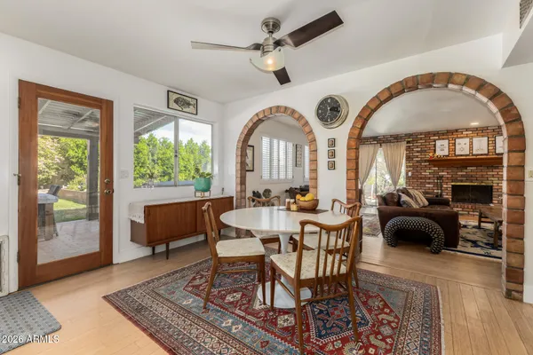 a view of a livingroom with furniture and a large window