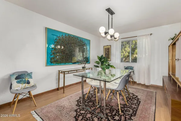 a kitchen with stainless steel appliances granite countertop a refrigerator sink and white cabinets