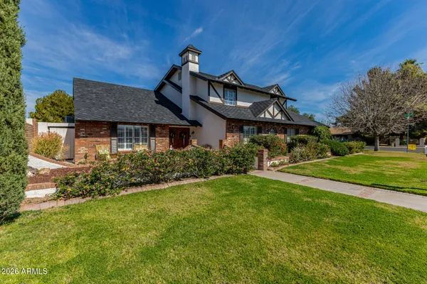 a front view of a house with garden