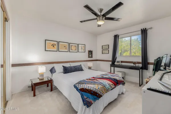 a view of bathroom with a sink and mirror