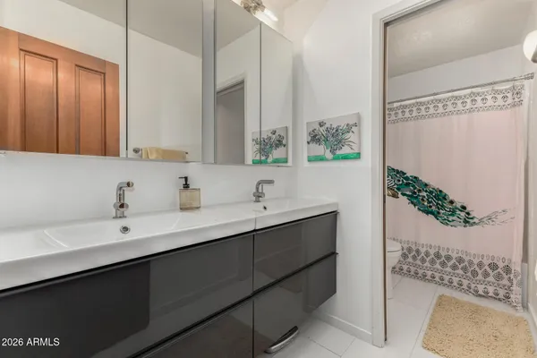 a bathroom with a toilet and a shower curtain