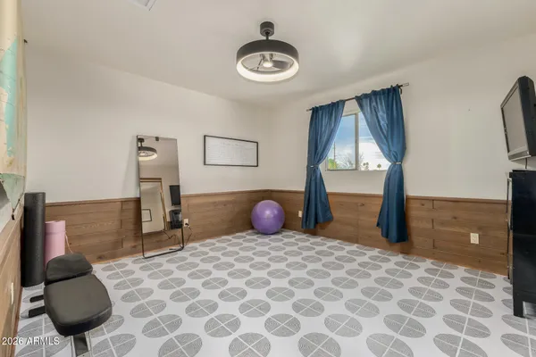 a view of a room with furniture and wooden floor