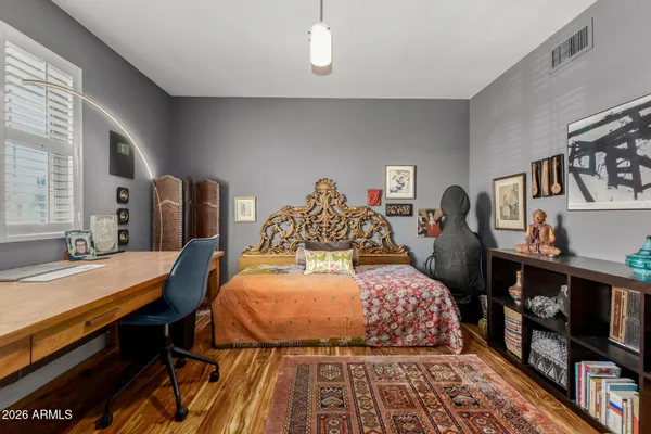 a bedroom with bunk bed and a window