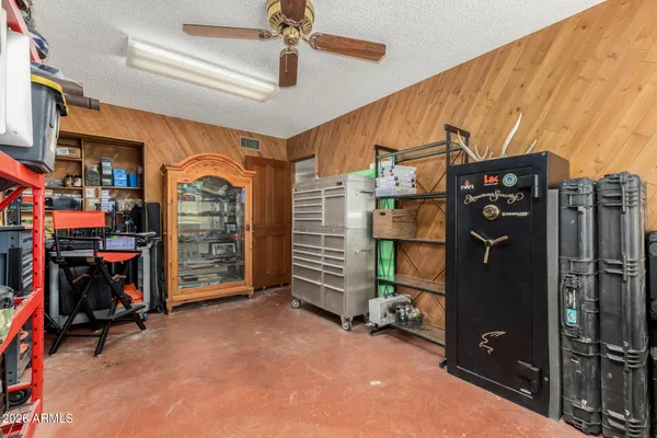 a bedroom with a bed and a lamp on table