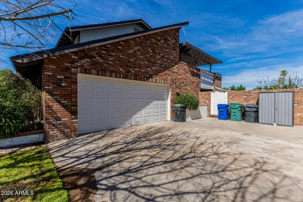 a backyard of a house with a garage