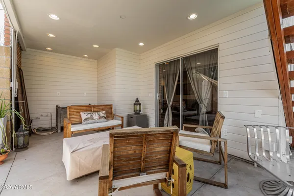 a swimming pool view with a outdoor seating