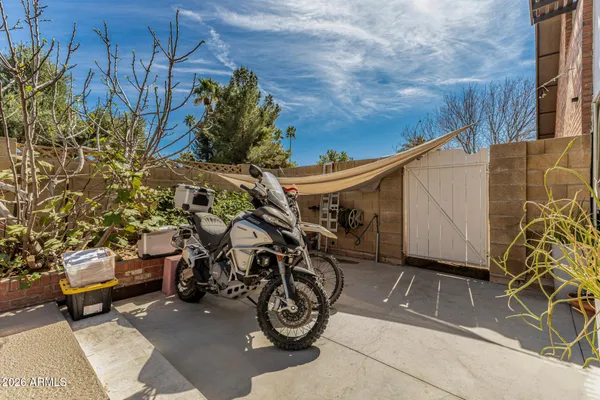 a view of a swimming pool with an outdoor seating