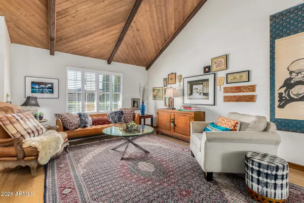a living room with furniture and a table