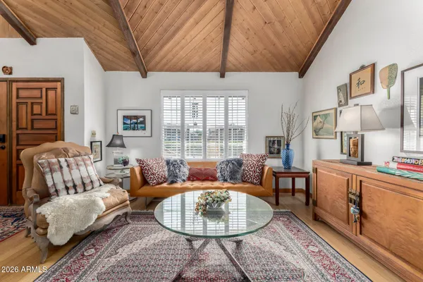 a living room with furniture and a window
