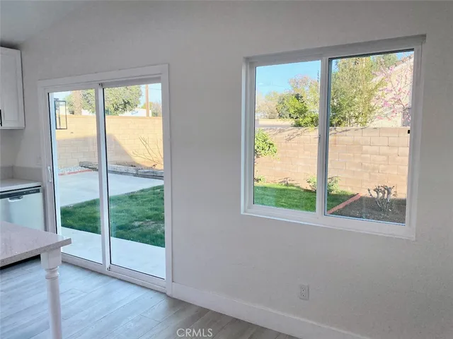 a kitchen with a sink and a large window