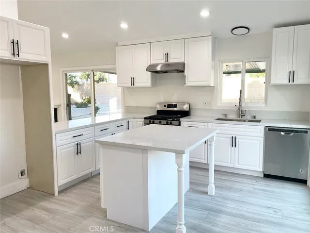 a view of a glass door and a yard from a window