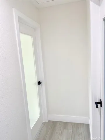 a view of a house with backyard and a tree