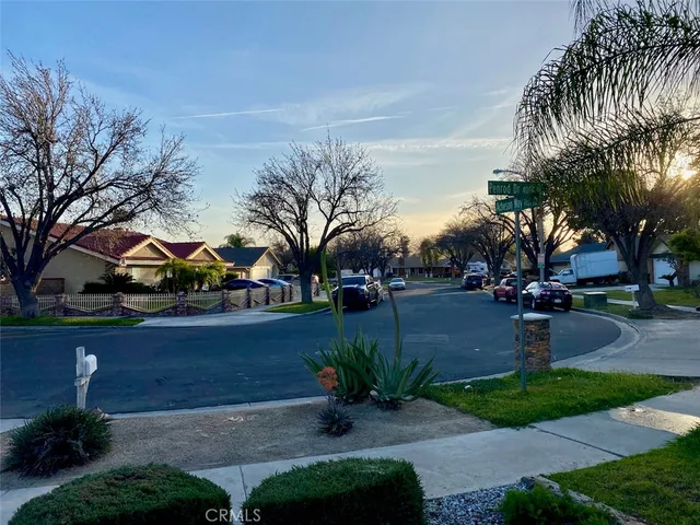 a view of street with parked cars