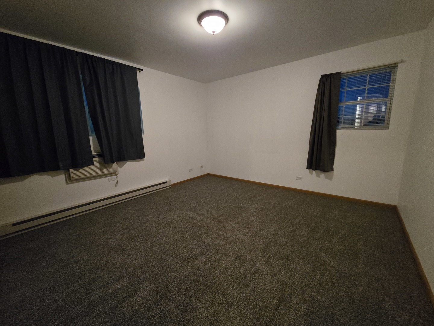 430 Cunat Boulevard, Unit 2A Richmond, IL 60071 - Photo 4 of 13 a view of a closet area with wooden floor