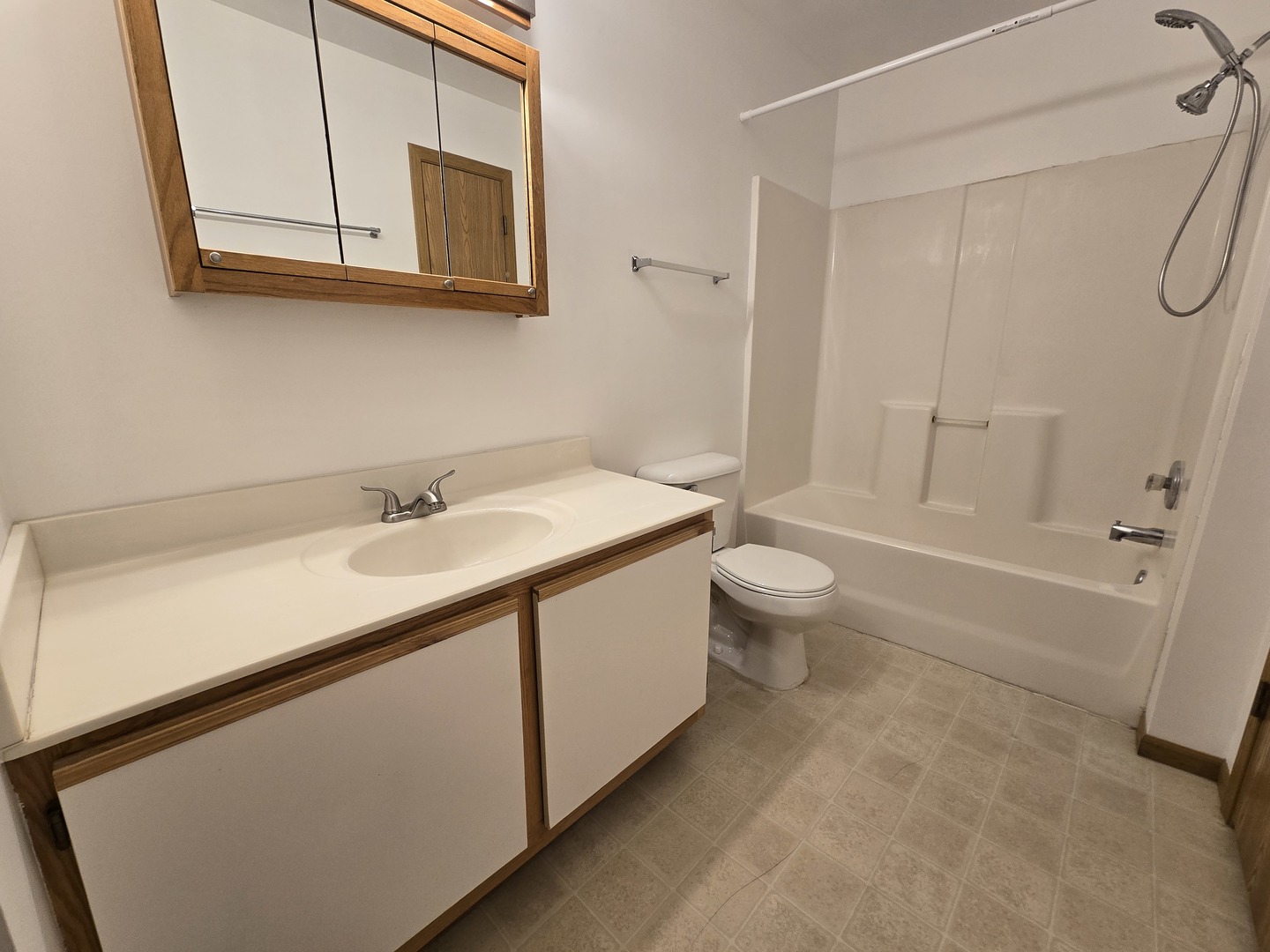 430 Cunat Boulevard, Unit 2A Richmond, IL 60071 - Photo 6 of 13 a bathroom with a sink a toilet and shower