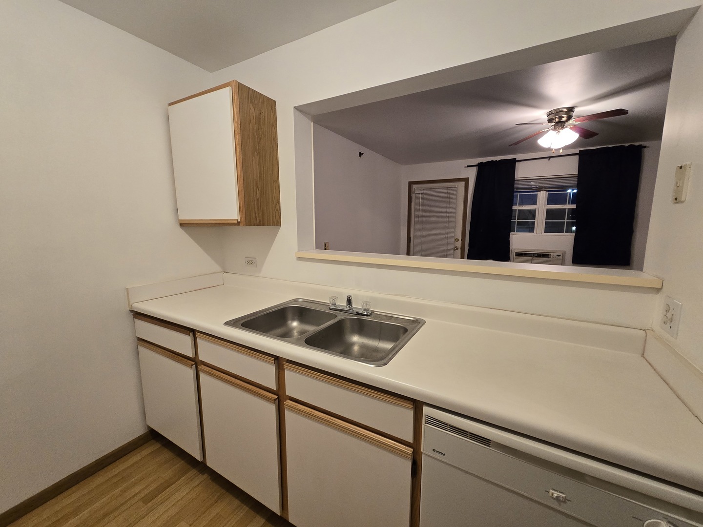 430 Cunat Boulevard, Unit 2A Richmond, IL 60071 - Photo 8 of 13 a bathroom with a sink and a mirror