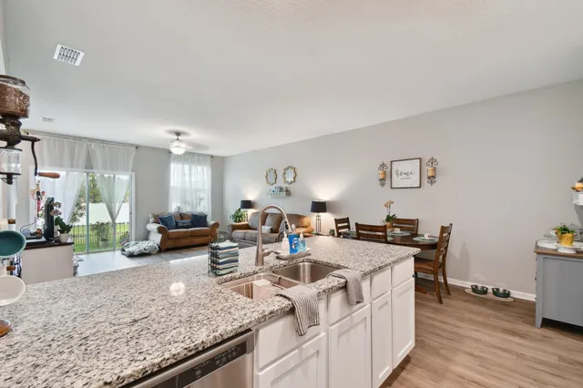 a view of a living room and dining room