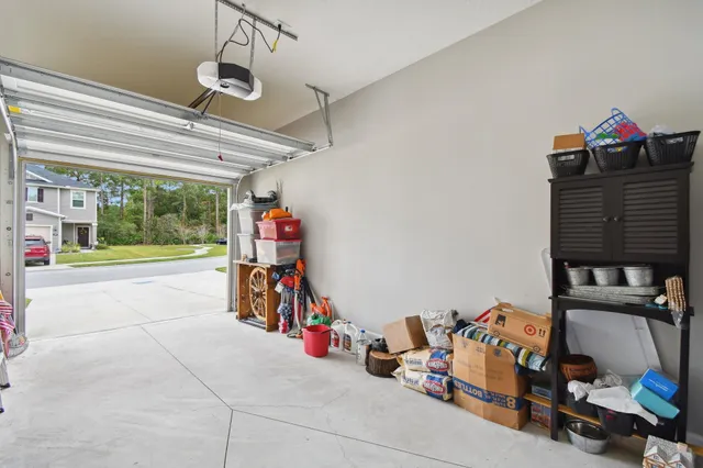 a view of walk in closet with clothes