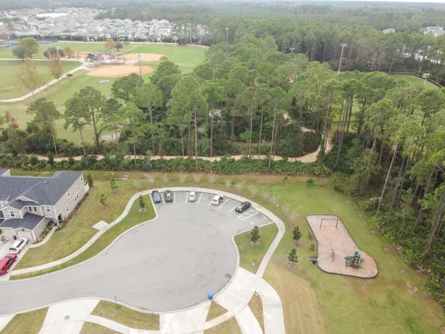 a view of a swimming pool with a yard