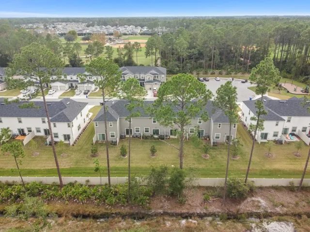 a view of a swimming pool with a yard