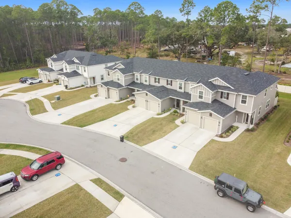 an aerial view of a house with a swimming pool