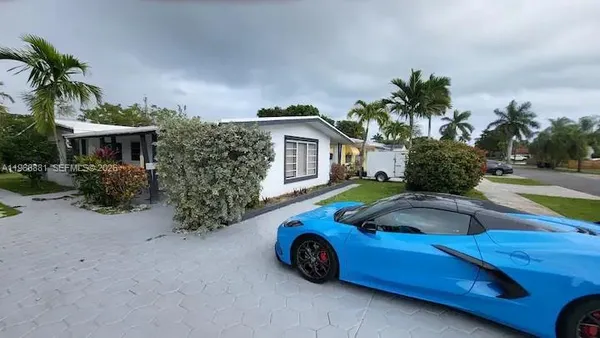 a front view of a house with parking space