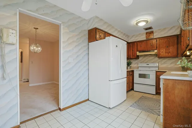 a view of an empty room with gym equipment