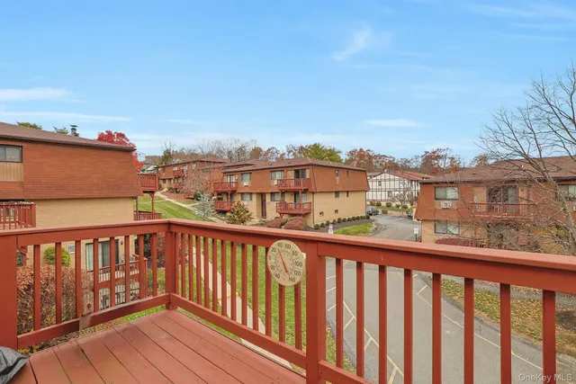 a view of a livingroom with furniture and a flat screen tv