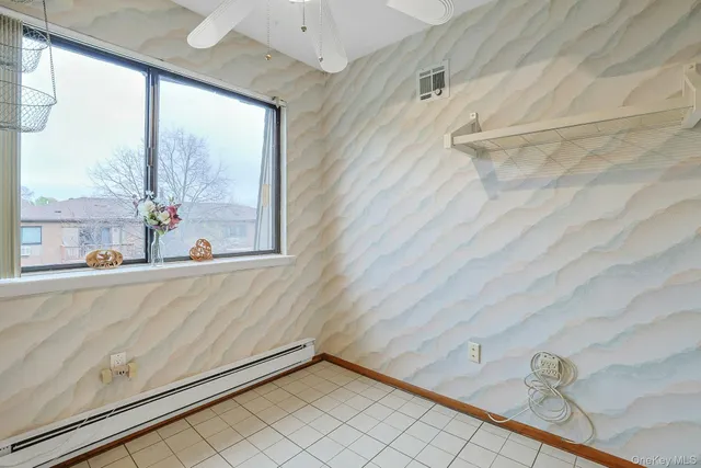 a kitchen with stainless steel appliances granite countertop a sink dishwasher stove and cabinets with wooden floor