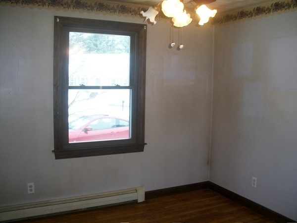 3 Highland Ridge Road Freetown, MA 02702 - Photo 18 of 21 a view of an empty room with wooden floor and a window