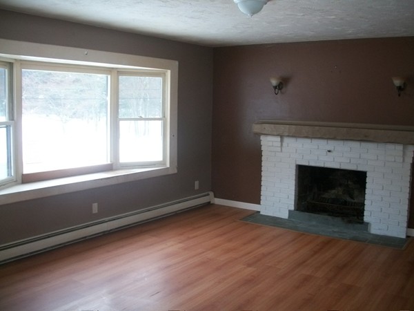 3 Highland Ridge Road Freetown, MA 02702 - Photo 2 of 21 a view of an empty room with wooden floor and a window