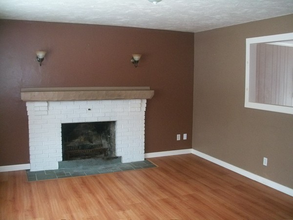 3 Highland Ridge Road Freetown, MA 02702 - Photo 3 of 21 a view of empty room with wooden floor and fireplace