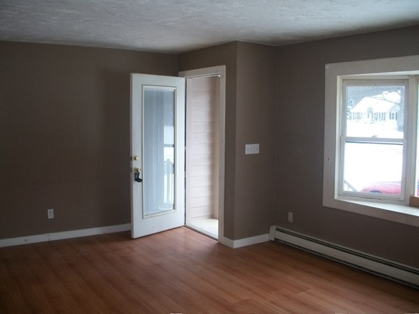 3 Highland Ridge Road Freetown, MA 02702 - Photo 5 of 21 an empty room with wooden floor and windows