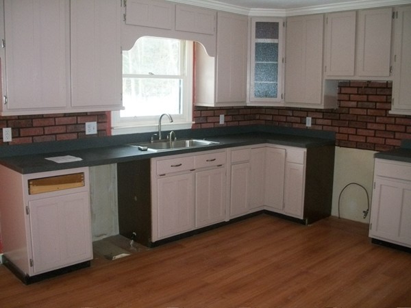 3 Highland Ridge Road Freetown, MA 02702 - Photo 7 of 21 a kitchen with granite countertop white cabinets and sink