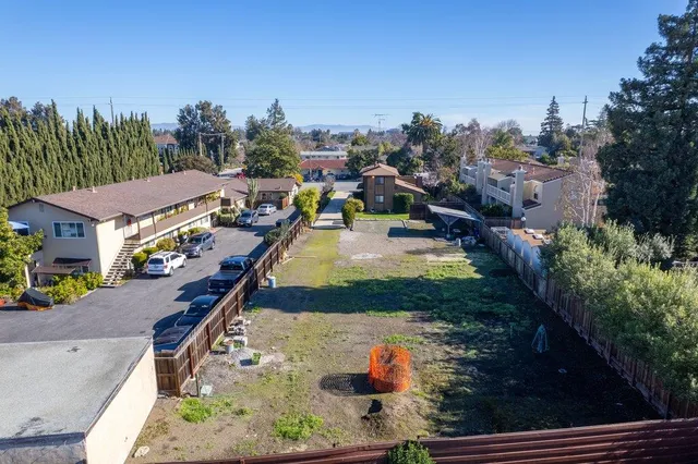 an aerial view of a house with swimming pool garden and outdoor seating