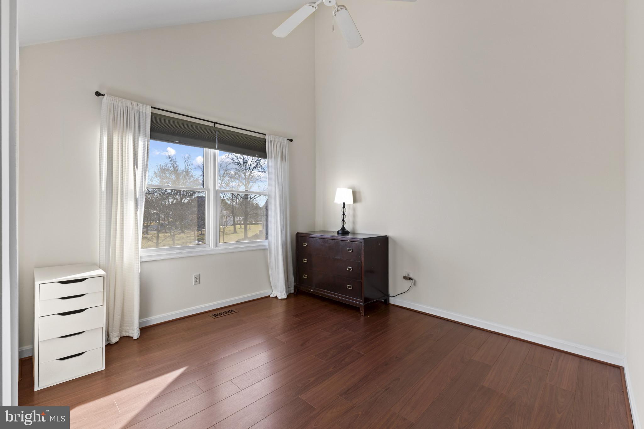 204 Ring Neck Court Chester, MD 21619 - Photo 15 of 29 an empty room with a window and wooden floor