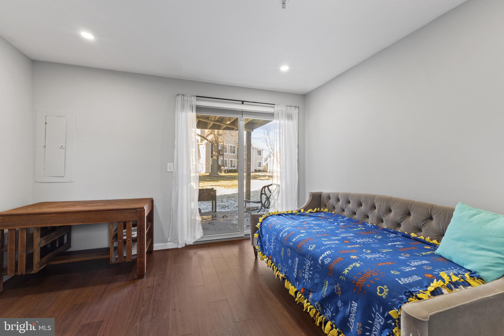 204 Ring Neck Court Chester, MD 21619 - Photo 22 of 29 a bedroom with a bed and a table