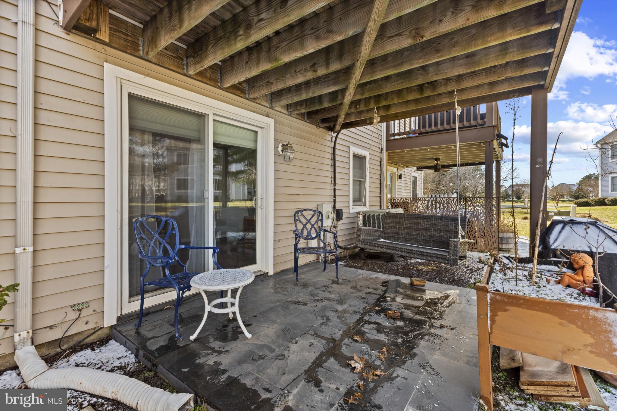 204 Ring Neck Court Chester, MD 21619 - Photo 26 of 29 a patio with table and chairs and potted plants
