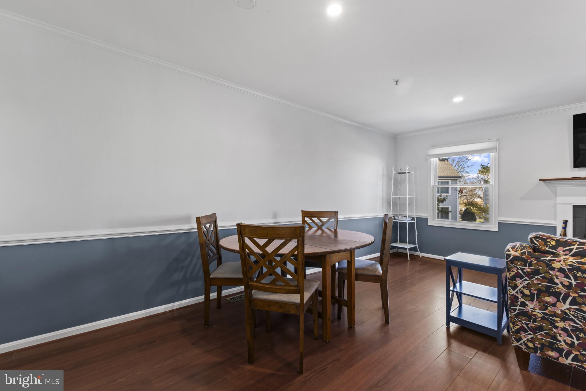 204 Ring Neck Court Chester, MD 21619 - Photo 5 of 29 a view of a dining room with furniture and wooden floor