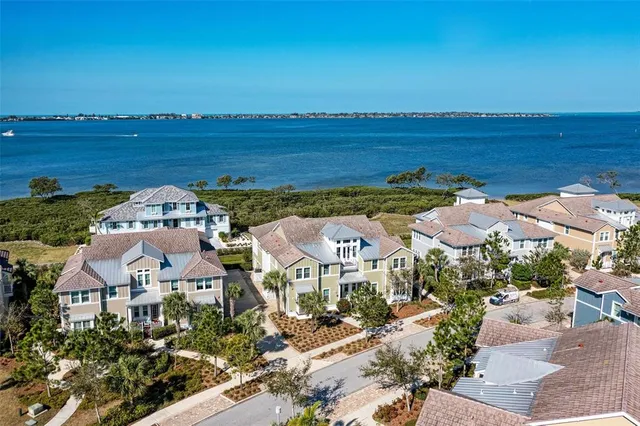 an aerial view of a house with a ocean view