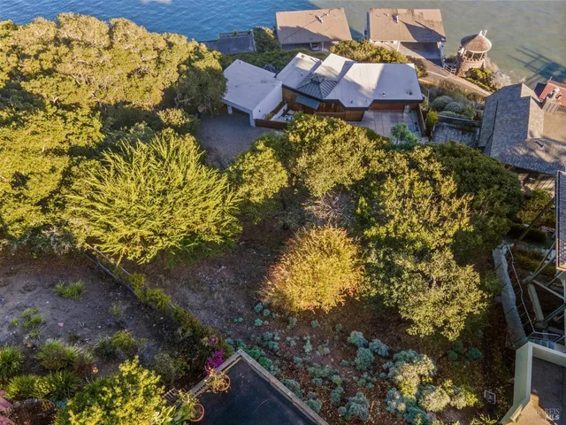 a aerial view of a house with a yard