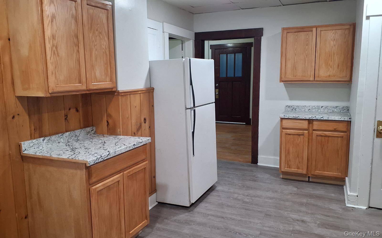 25 Van Orden Avenue Suffern, NY 10901 - Photo 4 of 10 a kitchen with stainless steel appliances granite countertop a refrigerator and a sink