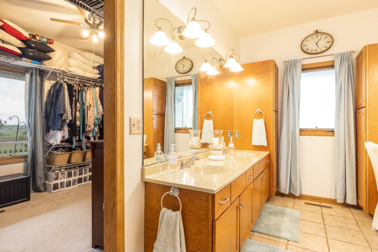 14539 Saunders Road Pecatonica, IL 61063 - Photo 24 of 55 a bathroom with a sink a mirror and a shower