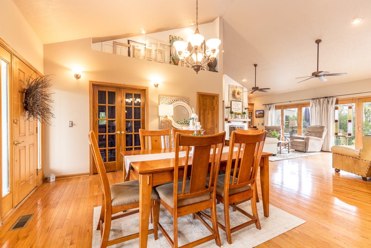 14539 Saunders Road Pecatonica, IL 61063 - Photo 6 of 55 a view of a dining room with furniture and wooden floor