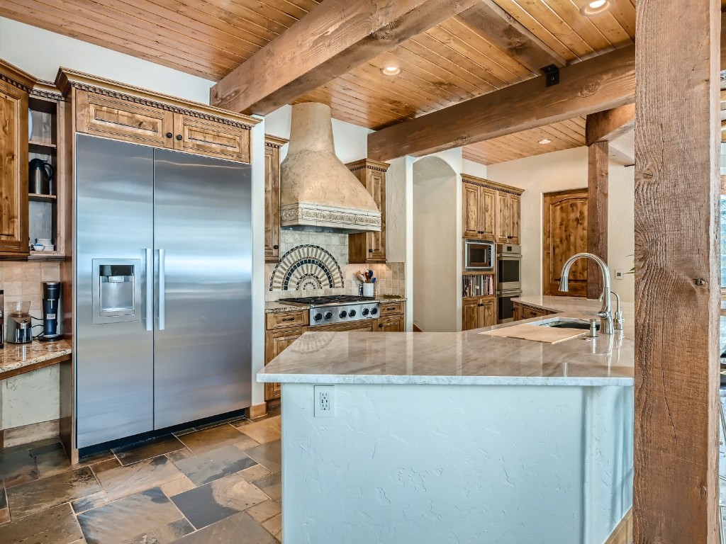 1817 Falcon Drive Silverthorne, CO 80498 - Photo 12 of 37 a view of a refrigerator in kitchen and utility room